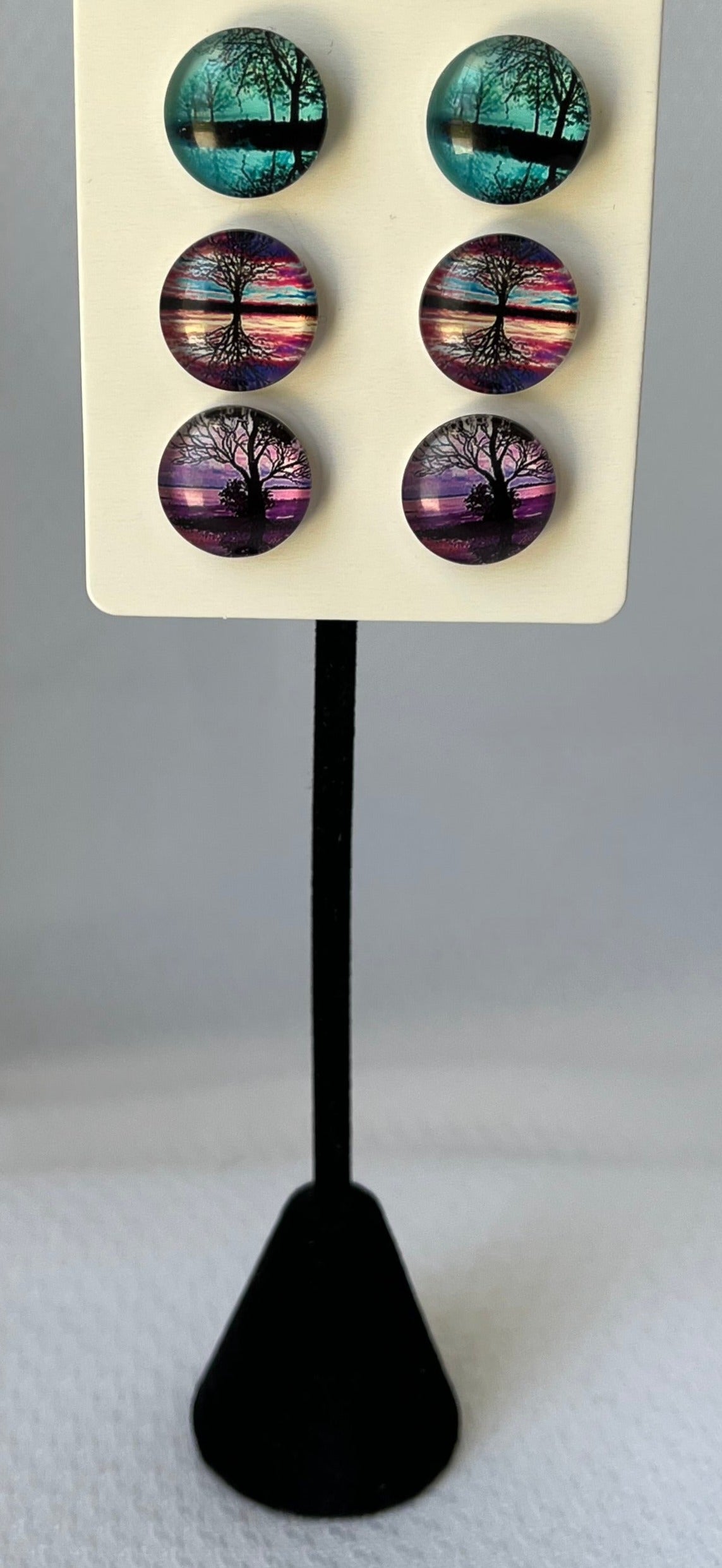 Three pair pack, teal, sunset, and purple with trees